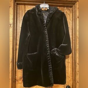 Luxurious Black Hooded Faux Fur Jacket with Black Leather Trim detailing